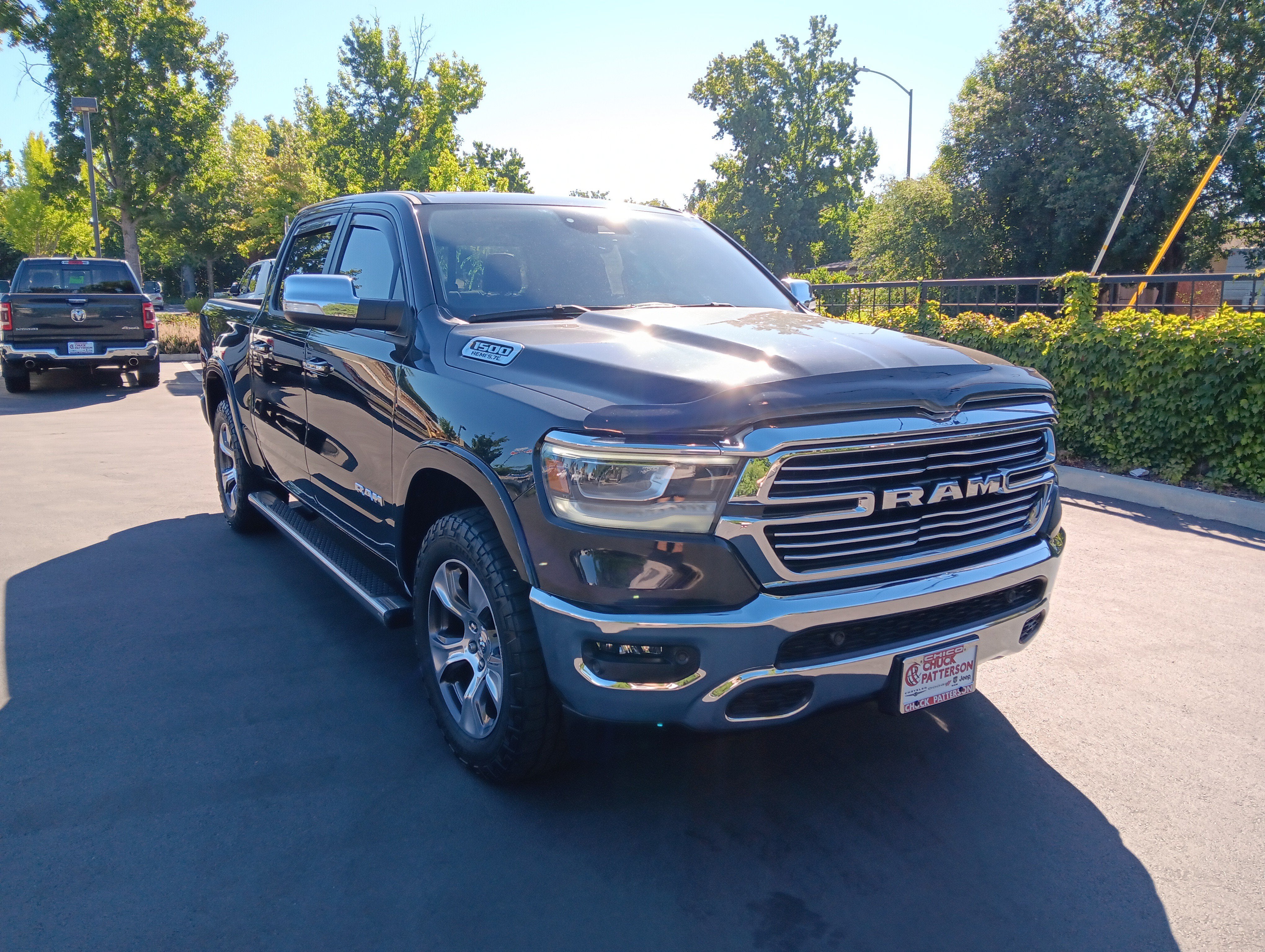 2022 RAM 1500 Laramie in Diamond Black Crystal Pearlcoat — front three-quarter view