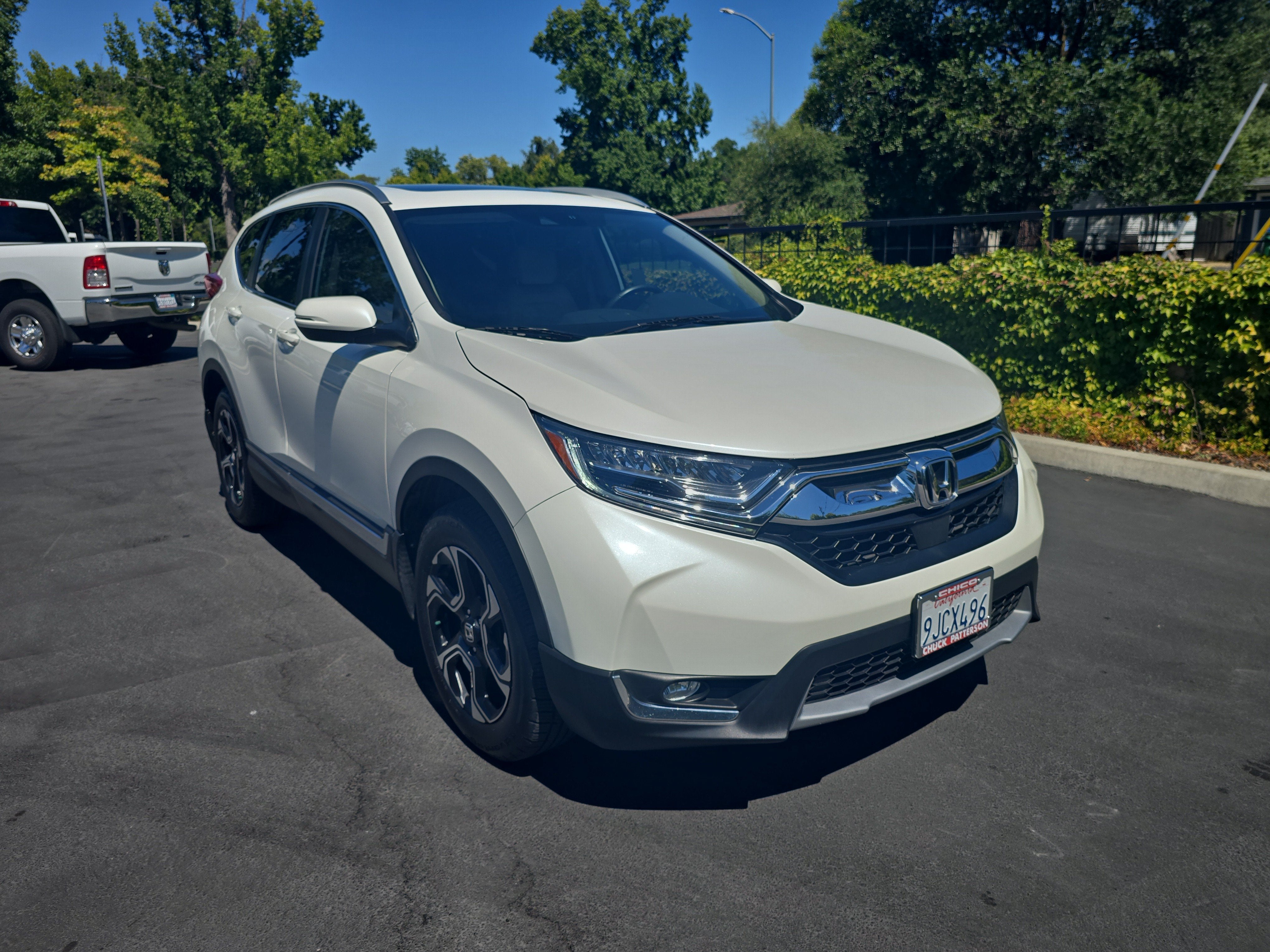 2018 Honda CR-V Touring in White Diamond Pearl — front three-quarter view