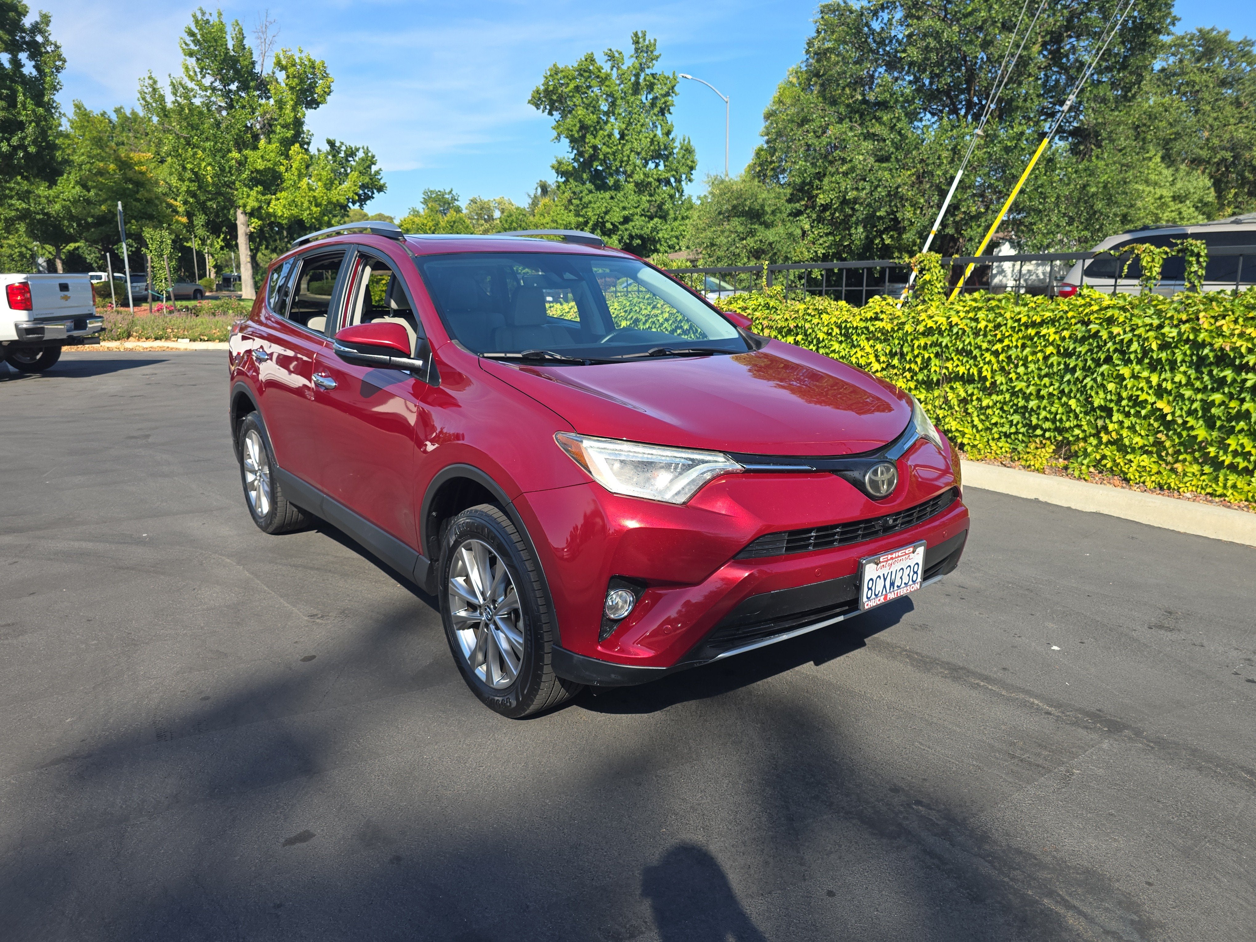 2018 Toyota RAV4 Limited in Ruby Flare Pearl — front three-quarter view