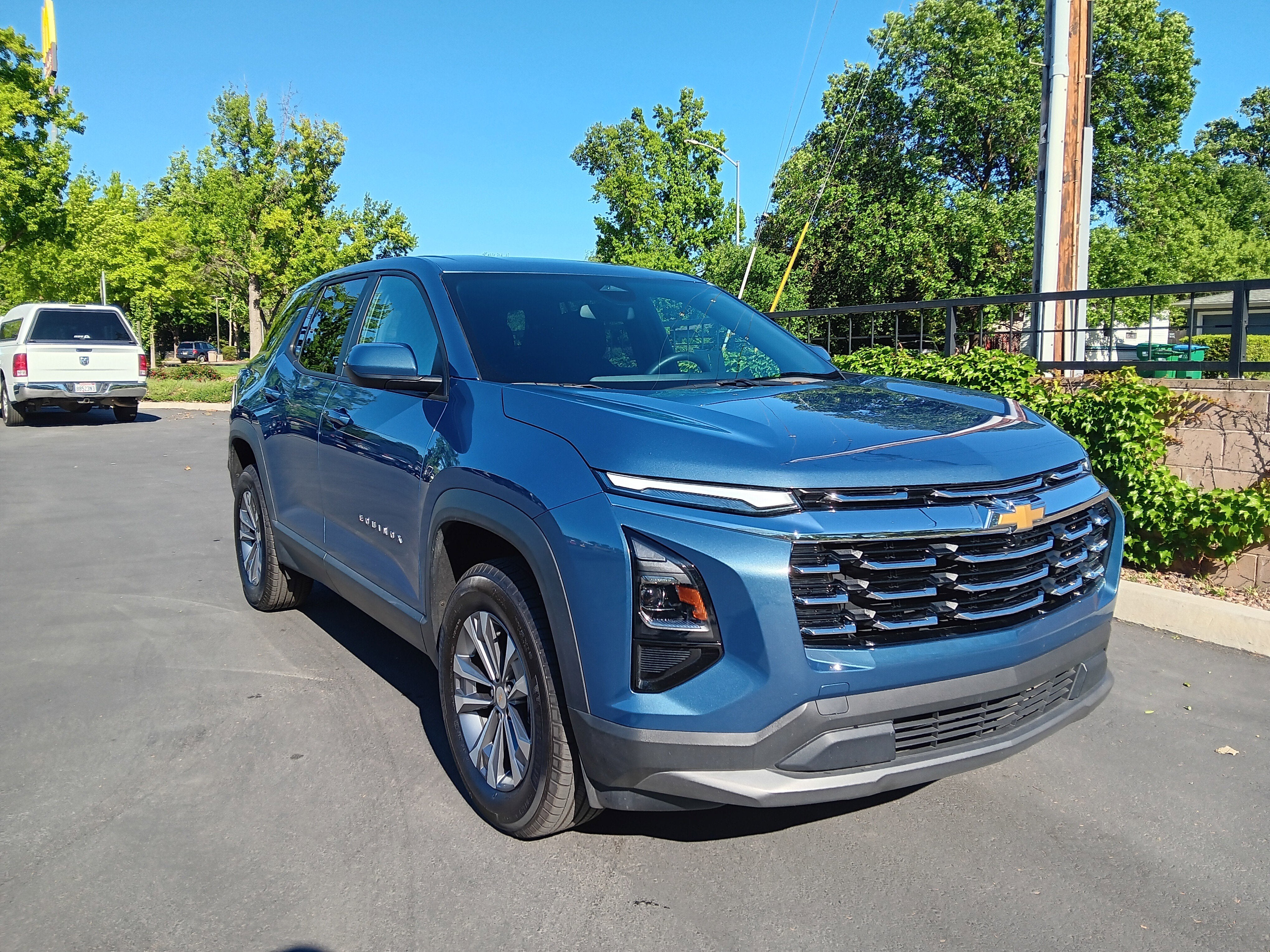 2025 Chevrolet Equinox AWD LT in Lakeshore Blue Metallic — front three-quarter view