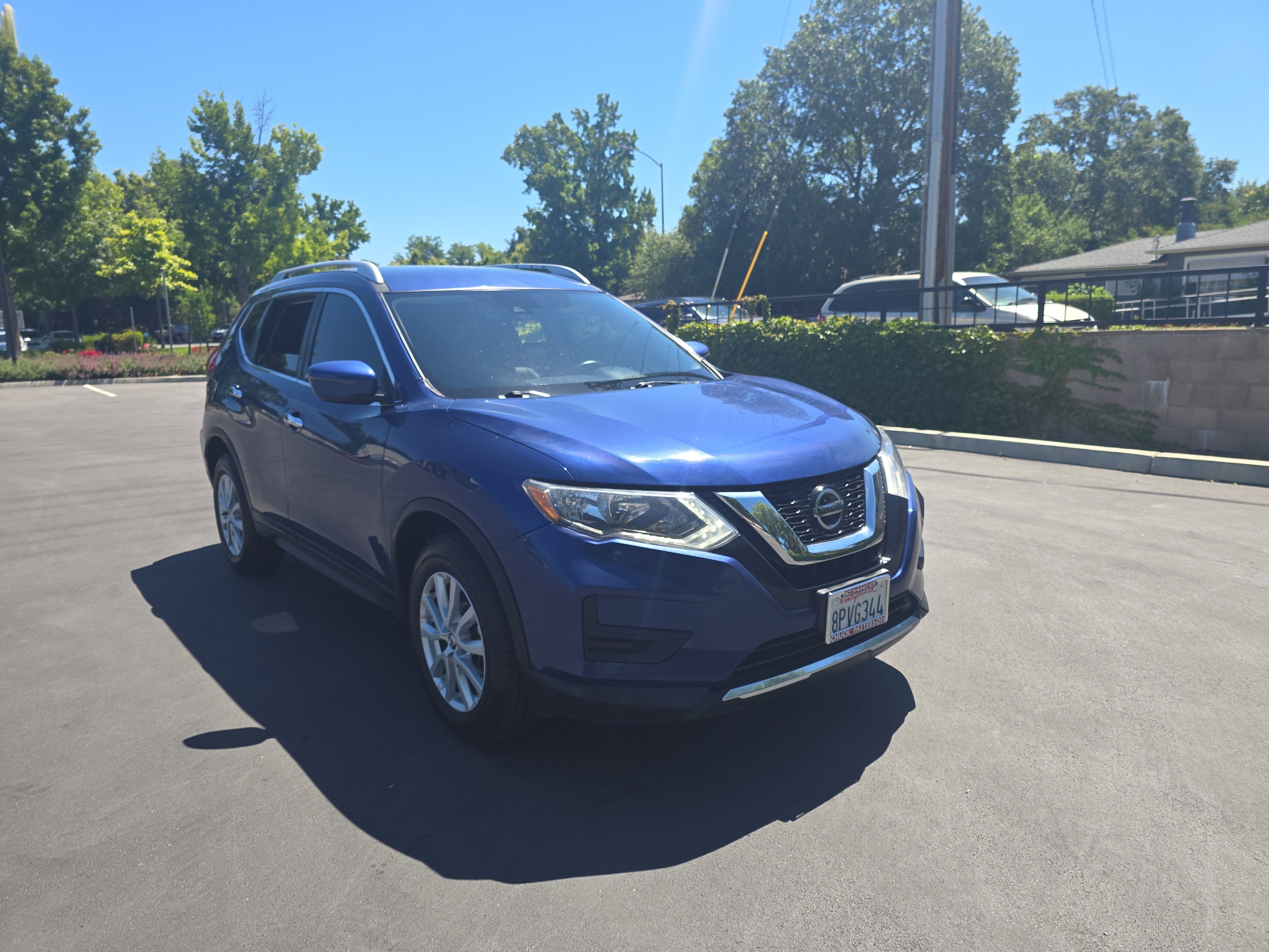 2019 Nissan Rogue SV in Caspian Blue Metallic — front three-quarter view